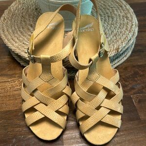 Never been worn Dansko sandal.